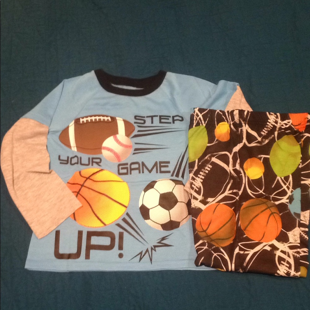 KOMAR KIDS PJ SET. Eye catching sports theme.